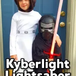 Two kids dressed up as Star Wars characters (Princess Leia and Kylo Ren) with Kylo Ren holding a lightsaber from Kyberlight and a text overlay that says, "Kyberlight Lightsaber Review".