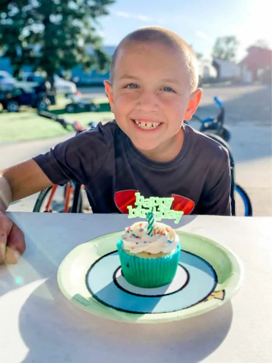 boy with cupcake - 13+ Best Frugal And Free Ways To Celebrate Birthdays