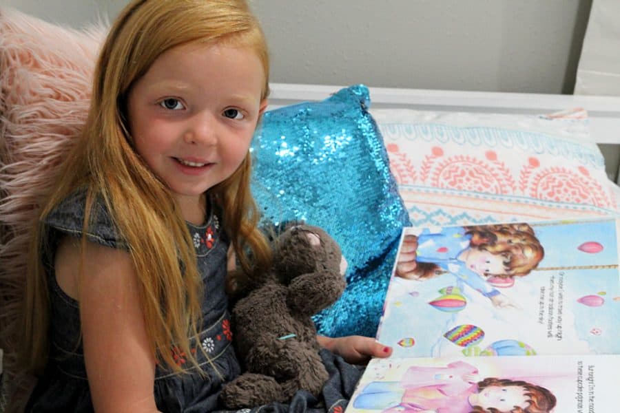 girl with book and teddy - Benefits Of Sleep For Kids + Storkcraft Marco Island Trundle Captain’s Bed Review