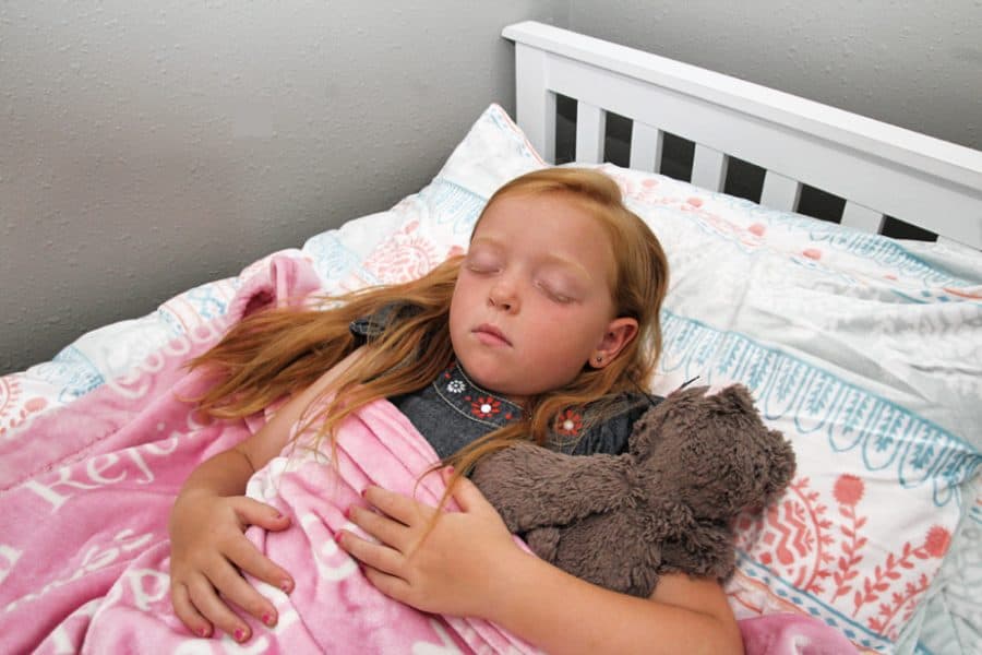 girl sleeping - Benefits Of Sleep For Kids + Storkcraft Marco Island Trundle Captain’s Bed Review
