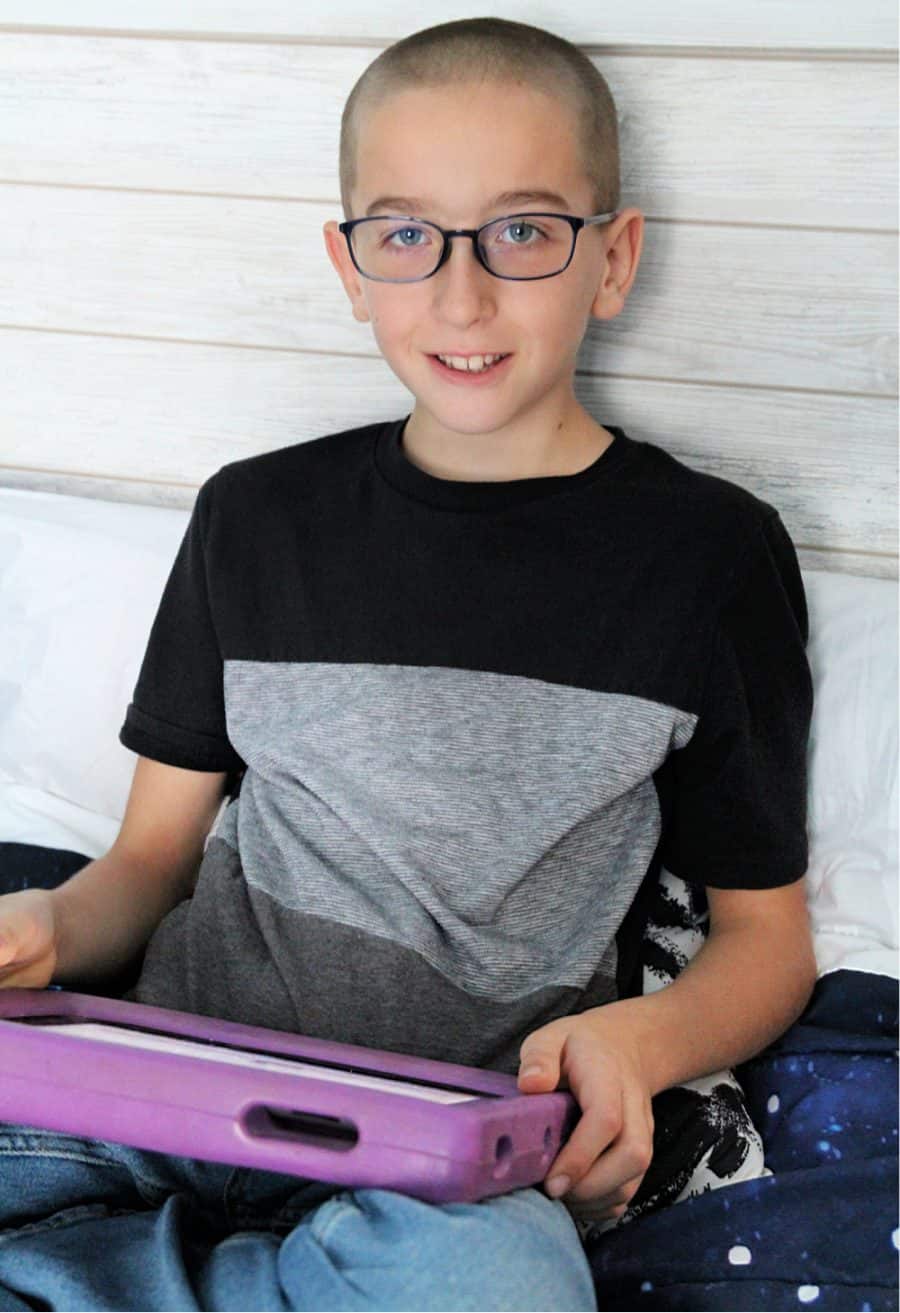 boy and ipad - Do Blue Light Glasses Really Work - What You Need To Know -- JINS Eyewear