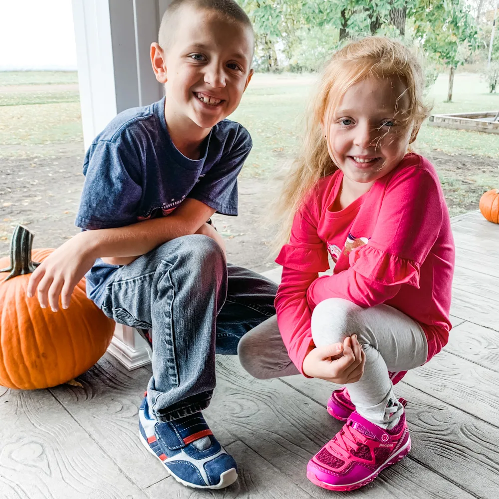 kids on a front porch - pediped shoes