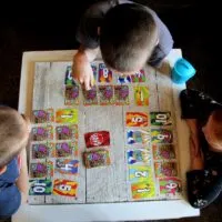 3 kids playing game- Tips For Planning A Fun Game Night