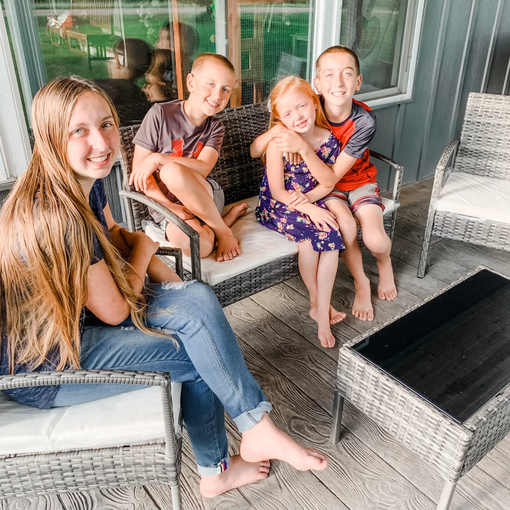 kids hanging out on patio - Top 11 Ways To Add Curb Appeal To Your Home
