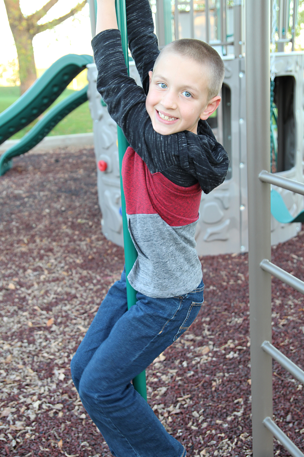 boy on playground fireman pole - Lifetime Double Adventure Tower Playset Review