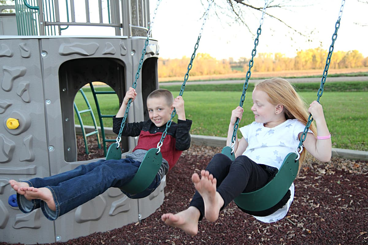 kids swinging - Lifetime Double Adventure Tower Playset Review
