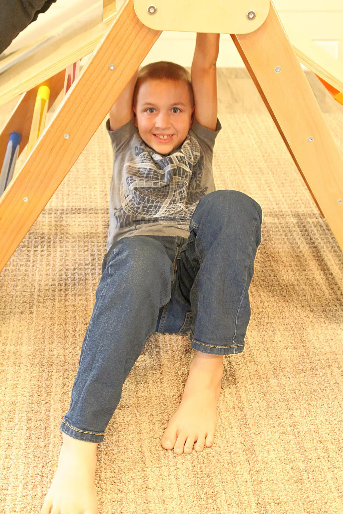 boy playing on climbing triangle 0 10 Activities To Do With A Piklar Triangle + Bunny Hopkins Review