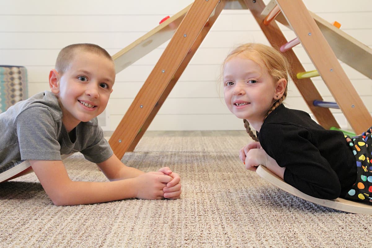 kids on wobble boards - 10 Activities To Do With A Pikler Triangle + Bunny Hopkins Wobble Board Review