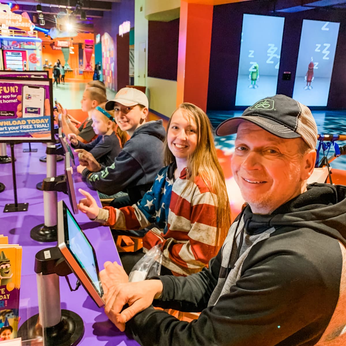 family playing electronics - Creative Play At Crayola Experience