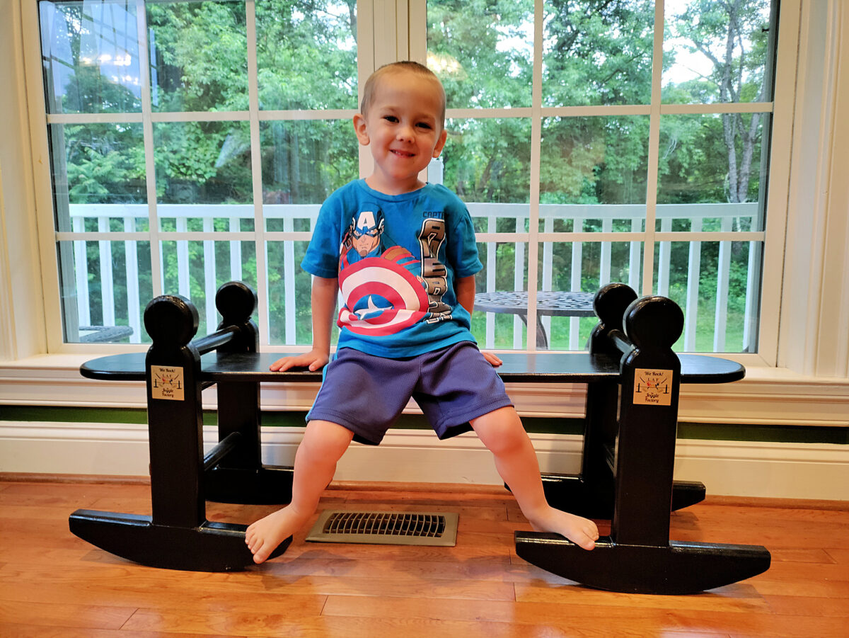 Four year old rocking on a joggling board