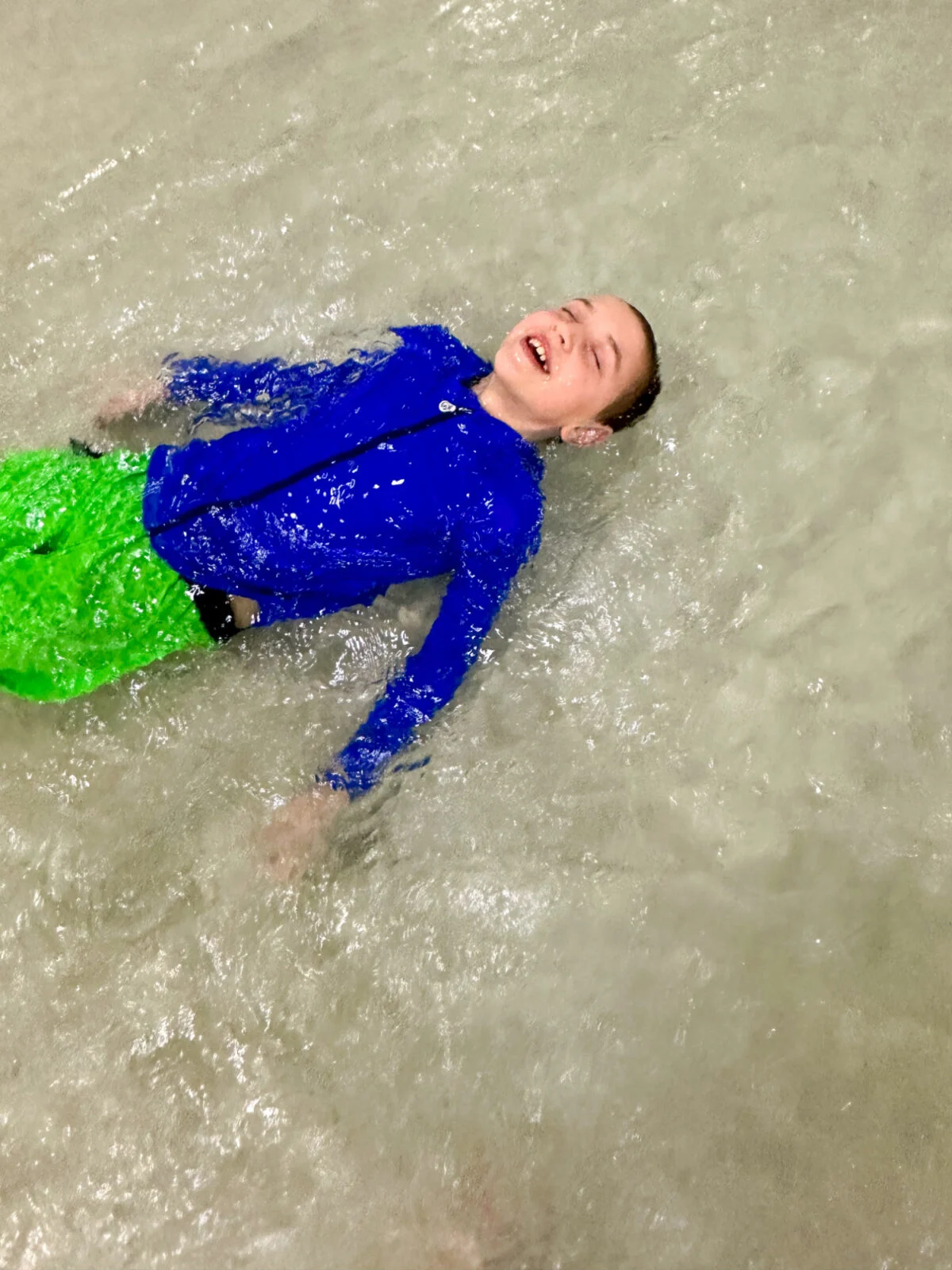 boy floating in pool - NoNetz Swim Trunks Review