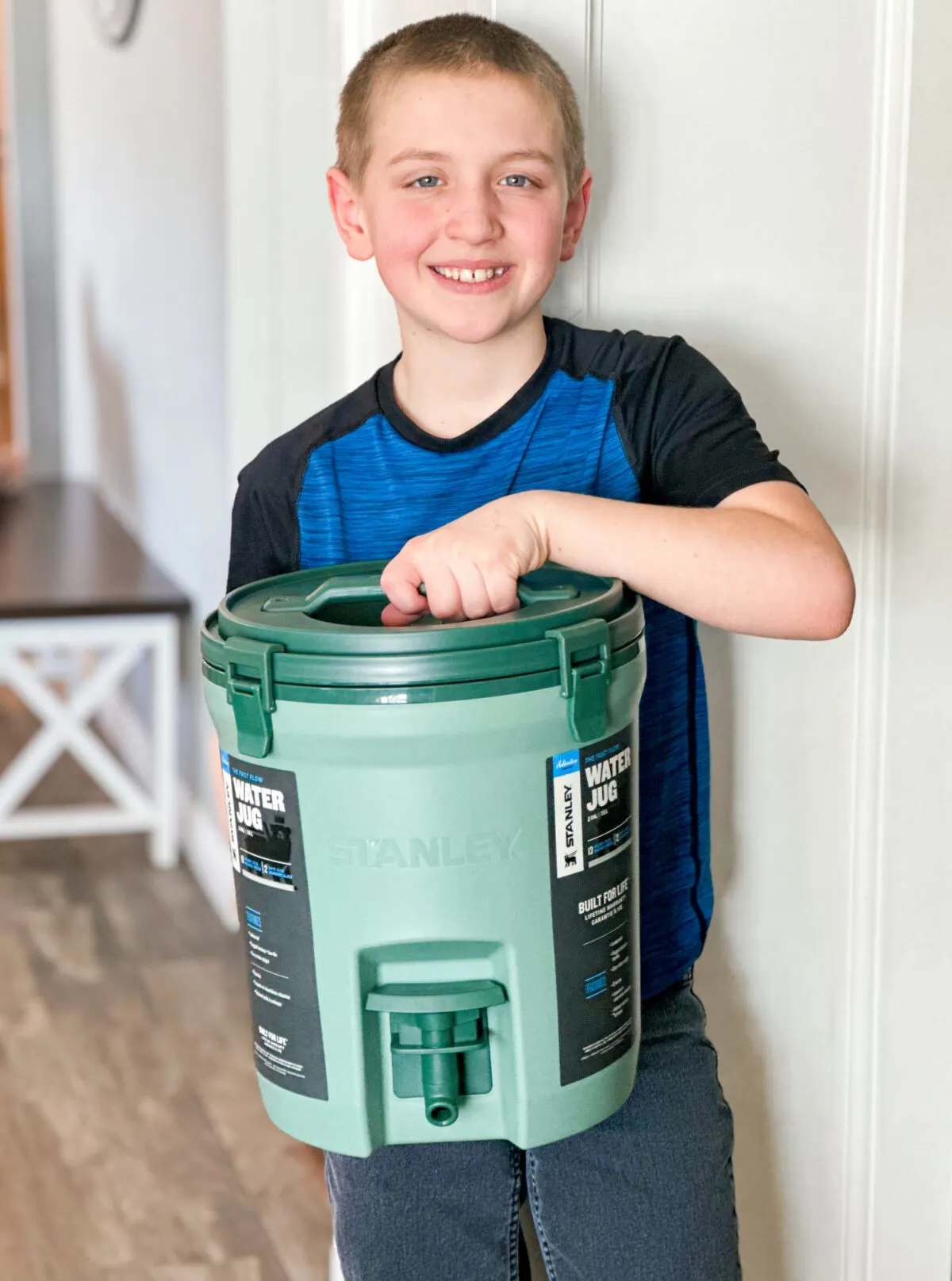 boy holding water jug - Best Easter Gifts From Stanley