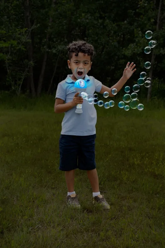 boy blowing bubbles - The Best Bubbles Toys: Fubbles Review + Giveaway